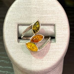 .925 Amber ring with 3 marquise amber stones differing colors.